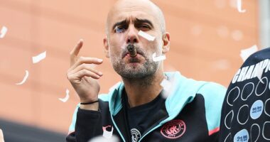 Pep Guardiola on the open-top bus parade to celebrate City's Premier League title in May 2024