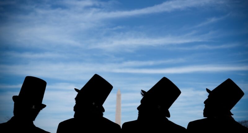 Photos show mock funeral for the penny at Lincoln Memorial