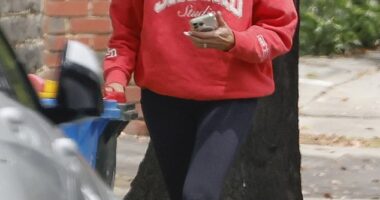 Jo Silvagni takes out the trash outside the home where her rapist son committed his vile crimes