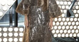 Rita Ora stunned in a dramatic fur-trim coat as she attended a junket in New York on Tuesday ahead of hosting Dick Clark's New Year's Rockin' Eve