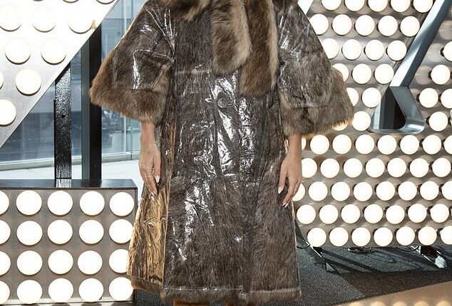 Rita Ora stunned in a dramatic fur-trim coat as she attended a junket in New York on Tuesday ahead of hosting Dick Clark's New Year's Rockin' Eve