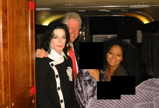 Bill Clinton is seen with his arm around Michael Jackson. The pair pose with Diana Ross and a redacted woman