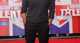 Simon Cowell hinted at tensions between himself and his former American Idol costar Ryan Seacrest in a new interview in which he claimed not to have followed his former costar's career in recent years; pictured in October in Blackpool, England