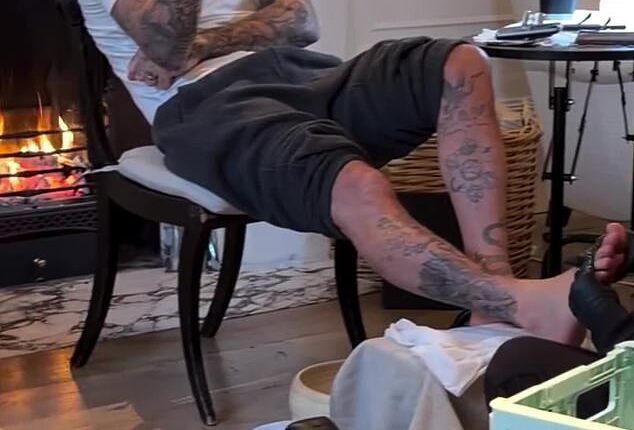 The family appeared to be getting into the spirit of things as David (pictured), 50, enjoyed a festive home pedicure