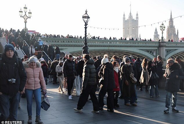 Photos taken this afternoon show London Bridge already packed out as Brits don wooly hats and scarves in preparation for the occasion