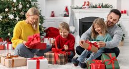 The rich are splashing out on extravagant gifts this year that include gold leaf-coated earbuds for children and celebrity-loved skincare. A stock image of a family at Christmas