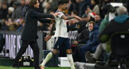 Thomas Frank (left) pushes Cristian Romero down the tunnel after he was sent off on Saturday