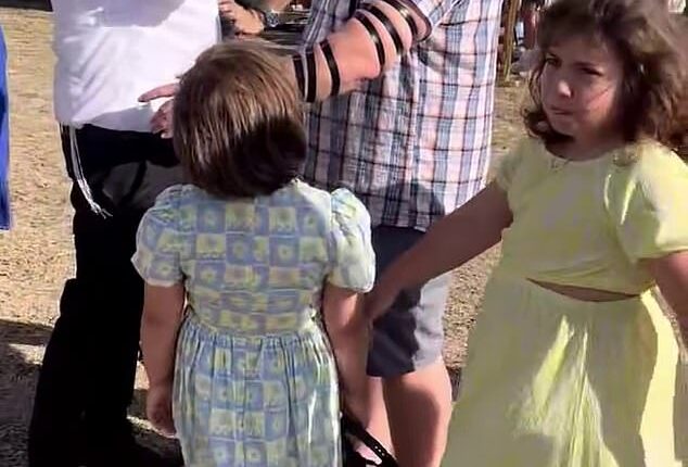 In a video shared to social media, Rabbi Eli Schlanger, 41, performed the Jewish ritual of tefillin on Matilda's dad as the little girl watched on in the moments before they were killed