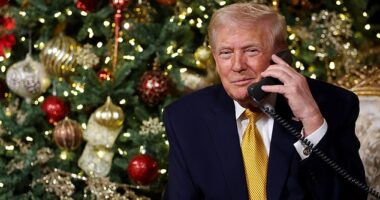 U.S. President Donald Trump calls children as he participates in tracking Santa Claus' movements with the North American Aerospace Defense Command (NORAD) Santa Tracker on Christmas Eve on December 24, 2025 in Palm Beach, Florida.