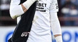 Rangers goalkeeper Jack Butland looks dejected after his side's defeat to Hearts