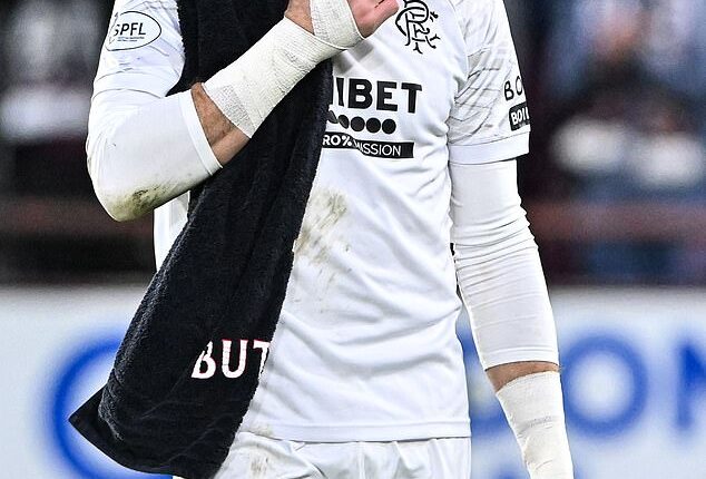 Rangers goalkeeper Jack Butland looks dejected after his side's defeat to Hearts