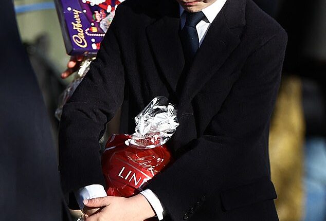 Prince Louis couldn't contain his glee after a royal fan gave the seven-year-old a massive tub of Lindor chocolates after the Christmas church service at Sandringham