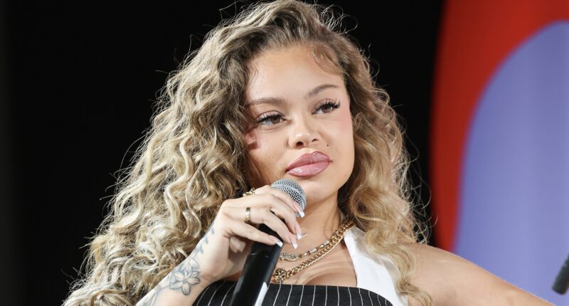 Latto Seemingly Reacts After Woman Goes Viral For Saying She's The Rapper's Estranged Half-Sister (WATCH)