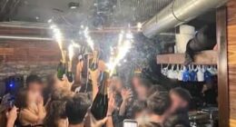 A photo appears to show the moment champagne sparklers set fire to material on the ceiling of the Swiss nightclub