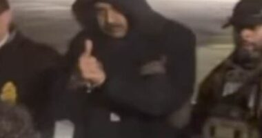 As US officials escorted Venezuelan President Nicolas Maduro out of a cavalcade of white vans, he flashed onlookers a thumbs up