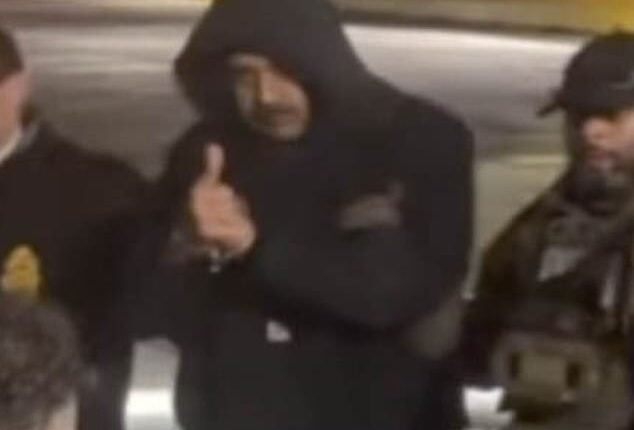 As US officials escorted Venezuelan President Nicolas Maduro out of a cavalcade of white vans, he flashed onlookers a thumbs up