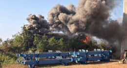 Smoke billowing from the wreckage of a passenger train after a construction crane collapsed onto it in Sikhio district, Nakhon Ratchasima, Thailand, 14 January 2026