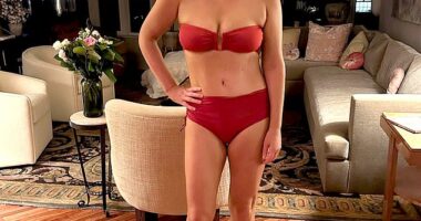 There she is – in a Manhattan apartment, at night no less – modeling bikinis and grinning like a mental patient