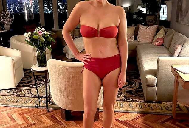 There she is – in a Manhattan apartment, at night no less – modeling bikinis and grinning like a mental patient