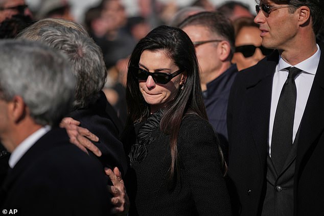 Anne Hathaway was left in tears as she, Donatella Versace and Tom Ford cut sombre figures while leading the mourners paying tribute to Valentino Garavani at his funeral in Rome