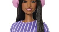 The first-ever autistic Barbie doll (pictured) has been released - featuring a fidget spinner, noise-cancelling headphones and a shifted eye gaze - but some have argued it is guilty of 'reinforcing stereotypes'