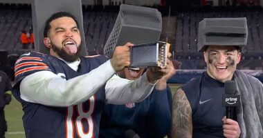 DJ Moore (center) and Colston Loveland (right) laugh as Caleb Williams (left) grates cheese