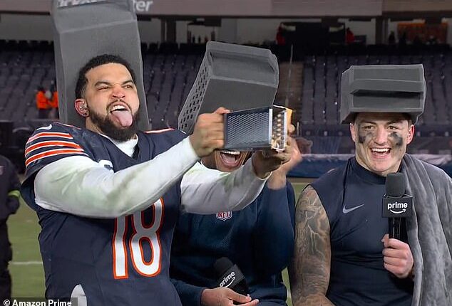 DJ Moore (center) and Colston Loveland (right) laugh as Caleb Williams (left) grates cheese
