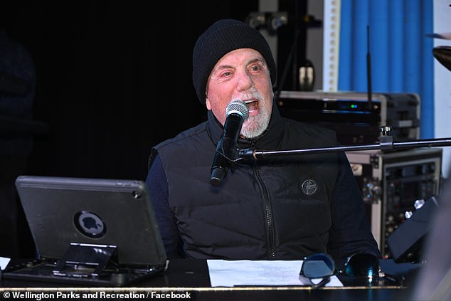Billy Joel gave fans a shock and a thrill when he turned up to a town celebration and played two of his hit songs