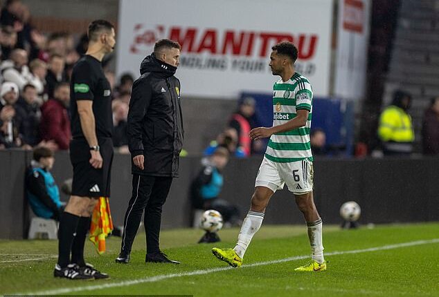 Auston Trusty of Celtic leaves the pitch after getting red carded in the 77th minute