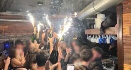 A photo appears to show the moment champagne sparklers set the nightclub on fire