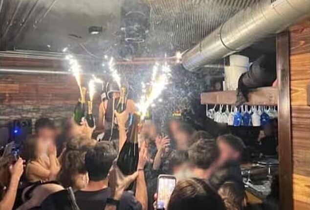 A photo appears to show the moment champagne sparklers set the nightclub on fire