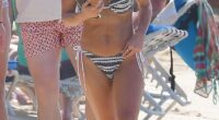 Coleen Rooney showed off her toned bikini body as she soaked up the sun in Barbados on Wednesday