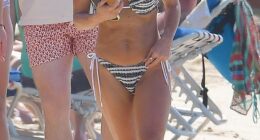 Coleen Rooney showed off her toned bikini body as she soaked up the sun in Barbados on Wednesday