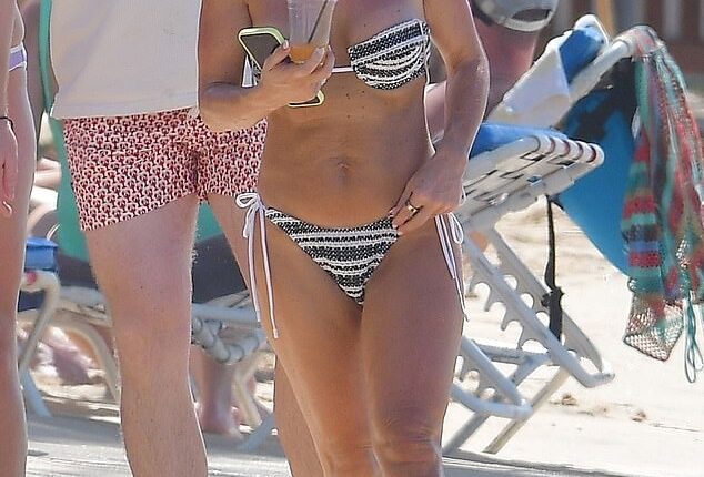 Coleen Rooney showed off her toned bikini body as she soaked up the sun in Barbados on Wednesday