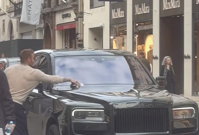 David Beckham ripped a parking ticket off the windscreen of his swanky Rolls Royce after a shopping spree at Rolex on Bond Street with wife Victoria on Sunday