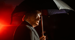 Donald Trump under an umbrella