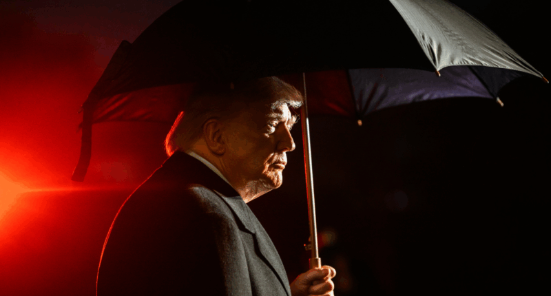 Donald Trump under an umbrella