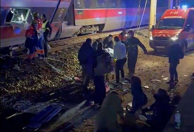 Desperate rescue bid continues through the night after Spanish rail disaster killed at least 21: Emergency workers battle to free trapped victims after one train derailed and a second ploughed into the wreckage