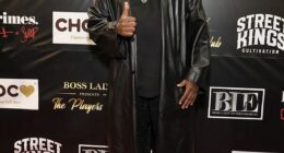 The comedian Corey Holcomb, 56, was accused in December 2024 of punching fellow comic Cristina Payne in the face outside the Hollywood Improv, and newly released video obtained by The Bizi Room appears to show the alleged altercation; Holcomb is pictured in May 2024 in LA