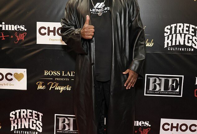 The comedian Corey Holcomb, 56, was accused in December 2024 of punching fellow comic Cristina Payne in the face outside the Hollywood Improv, and newly released video obtained by The Bizi Room appears to show the alleged altercation; Holcomb is pictured in May 2024 in LA