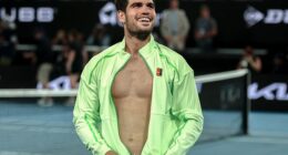 Carlos Alcaraz looks up to his fans after beating Alex de Minaur on Tuesday night - and he had one famous fan in the stands