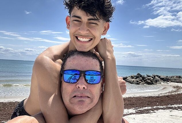 Luis Guembes is seen smiling with his father in the first picture released of him since he was stabbed to death on Monday evening in Guildford