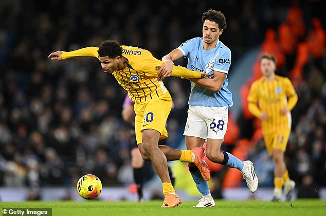 Max Alleyne (right) made his debut for Manchester City against Brighton on Wednesday night