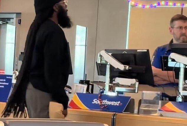 An irate passenger was caught on camera threatening a Southwest employee at Kansas City International Airport on Monday