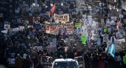 Protesters against Immigration and Customs Enforcement (ICE) march through the streets of downtown Minneapolis, Minnesota, on Sunday