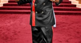 Pajama vibes! Snoop Dogg looked like he was going to an entirely different even as he sported a black satin suit on the Globes red carpet. The suit featured red stripe detailing on the blazer and side of his pants. He completed the look with a shiny black pair of dress shoes