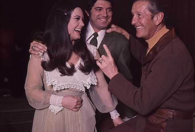 Singer Guy Hovis has died at age 86 after battling an illness in the hospital; Hovis pictured center with then-wife Ralna English and Lawrence Welk
