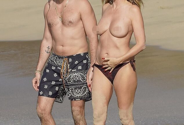 Heidi Klum went topless while enjoying a beach day in St. Barths with husband Tom Kaulitz last week