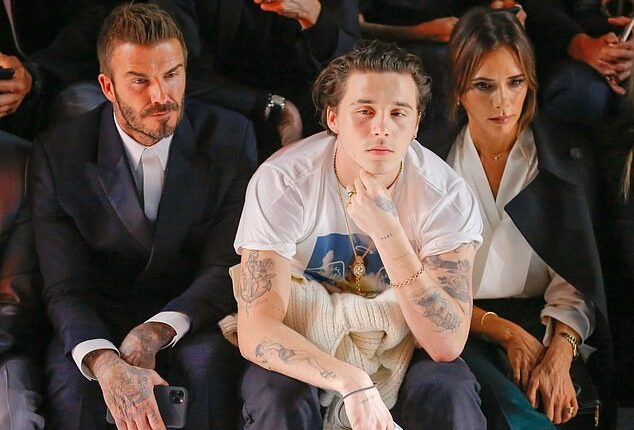 Brooklyn Beckham was once so homesick for his family that he dropped out of his New York photography course after just one year (Seen with mum Victoria and dad David in 2020)