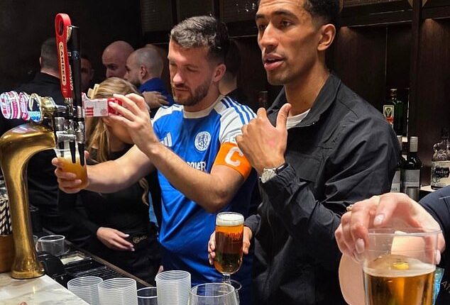 Macclesfield FC captain Paul Dawson (left), pictured still in his kit and pulling pints after his side's famous win over Crystal Palace, was shovelling snow last Tuesday night